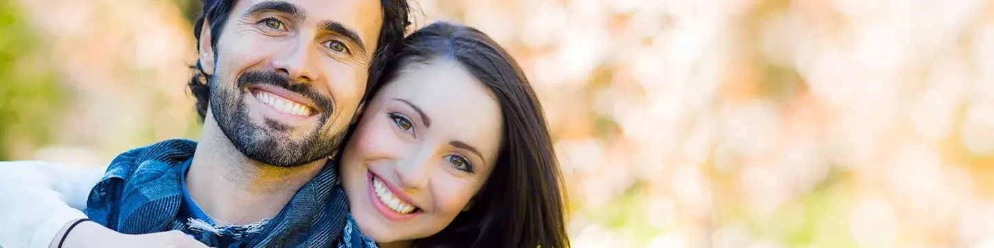 Smiling couple with bright white teeth, representing teeth whitening at Bridgeport Smiles in Bridgeport, Texas